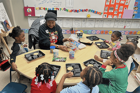 A teacher and students in a classroom at Caniff Liberty Academy